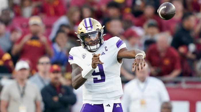 Washington quarterback Michael Penix Jr. throws a pass while playing against USC.